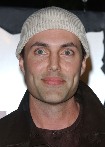 a man wearing a beanie looking at the camera