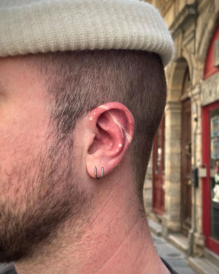 a man with ear piercings on his ears