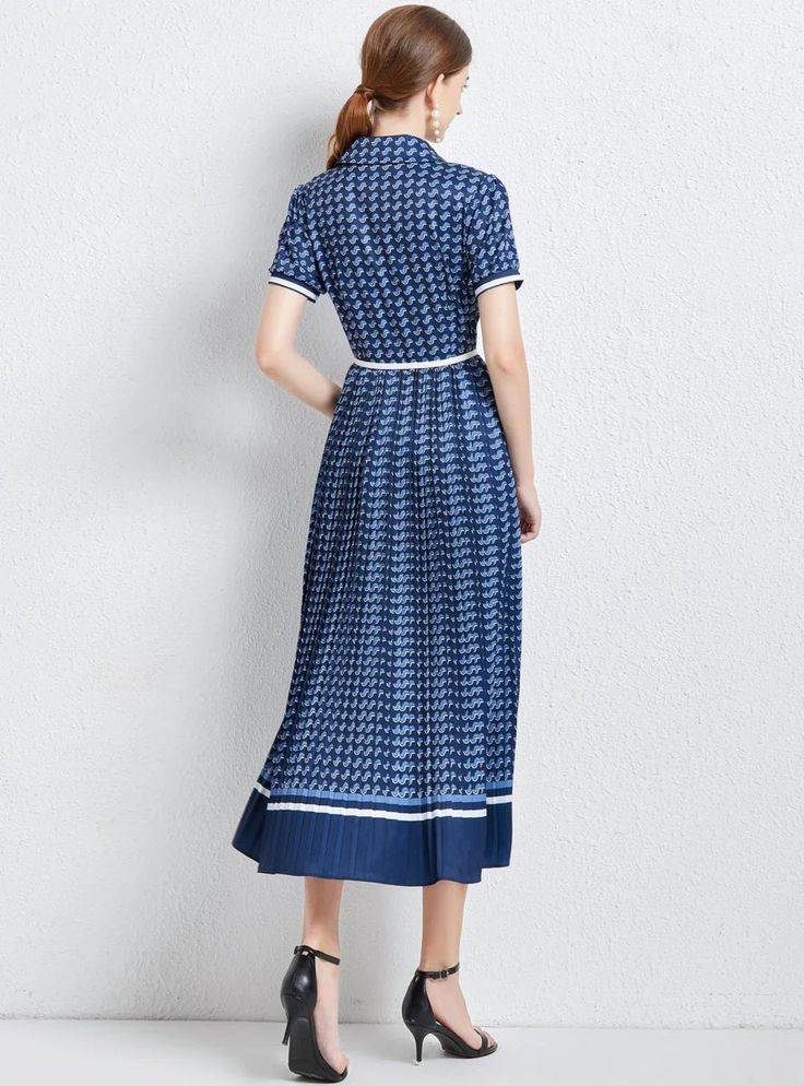 Step into the new season in style with this plaid midi drses. With its chic plaid print and button front detail, this dress is sure to be your next wardrobe favorite. The playful ruffles at the hem, paired with a timeless pleated skirt, give this dress a unique character. Its shirt collar and regular short sleeves add a touch of class, making it suitable for any event. Pair it with ankle boots and a mini bag for a casual, laid-back vibe, or dress it up with high heels and gold hoops for an elega