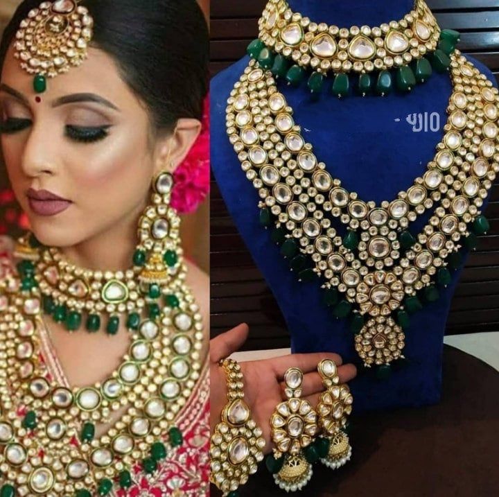 a woman in a green and gold bridal set with matching necklaces, earrings and ring