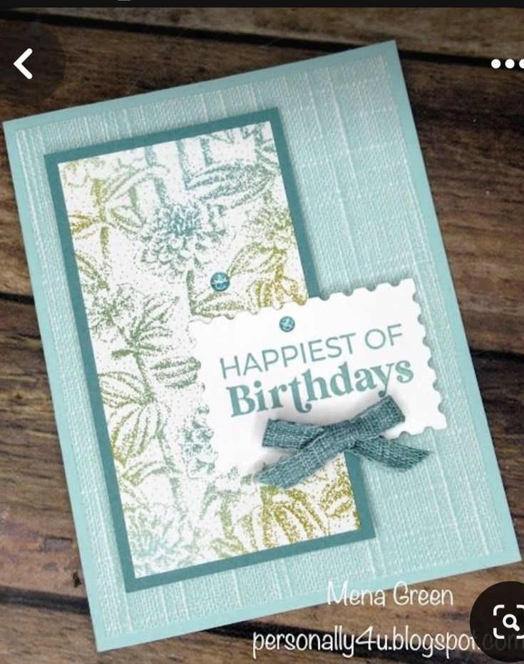 a close up of a birthday card on a wooden surface with the words, happy birthday