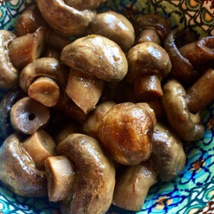 mushrooms are in a bowl on a table