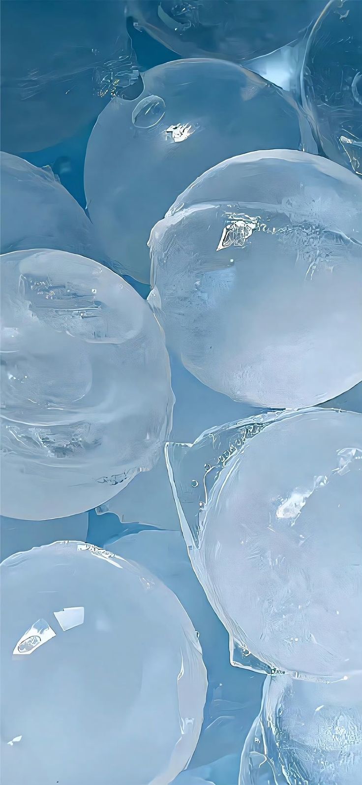 ice bubbles floating on top of blue water