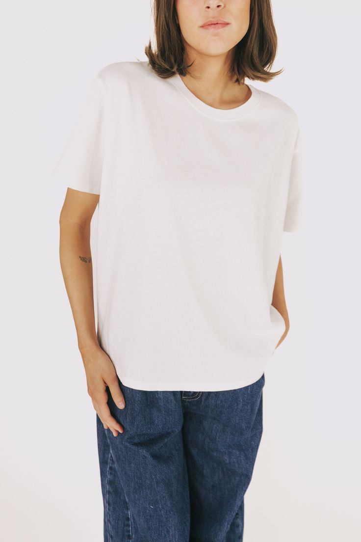 The Blinded Top: a basic white tee that's perfect for any occasion! Comfy enough for a casual day out, yet versatile enough to dress up or down. A must-have for any wardrobe. Details Crew neckline Basic tee Boxy fit Sizing Approximate measurements: SIZE LENGTH BUST Small 25" 44" Medium 26" 46.5" Large 26.5" 50" Fabric has some stretchModel is 5'8" wearing small Material 100% Cotton Hand wash coldDo not bleachHang dry Do not iron Basic White Tee, Basic Tee, Days Out, White Tee, Crew Neckline, Must Haves, Hand Wash, Dress Up, Off White