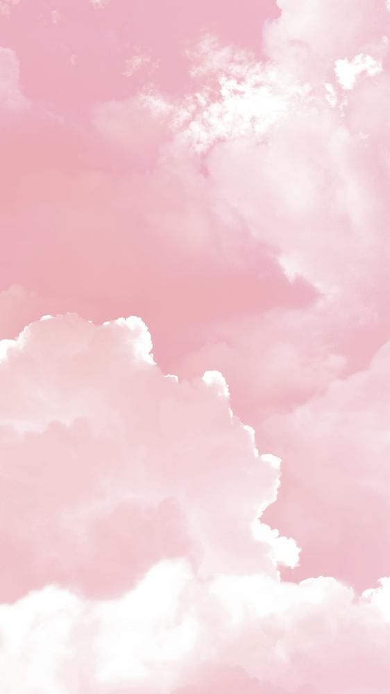 the sky is filled with white clouds and pink hued colors in shades of pink