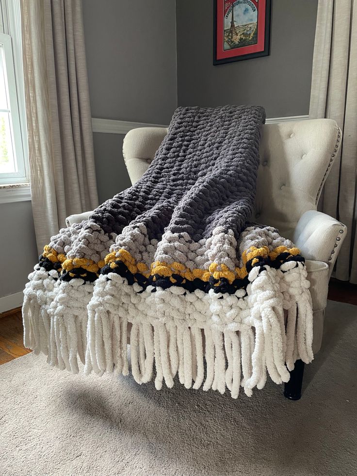 Chunky Knit Fringe Blanket | Gray and Yellow Knit Throw - Hands On For Homemade Gray Chunky Knit Blanket, Gray Afghan Crochet, Black And White Chunky Knit Blanket, Knit Blanket Color Schemes, Chunky Blanket Color Ideas, Chunky Knit Blanket Ideas, Chunky Knit Blanket Pattern Color Combos, Big Yarn Blanket, Gold Blanket