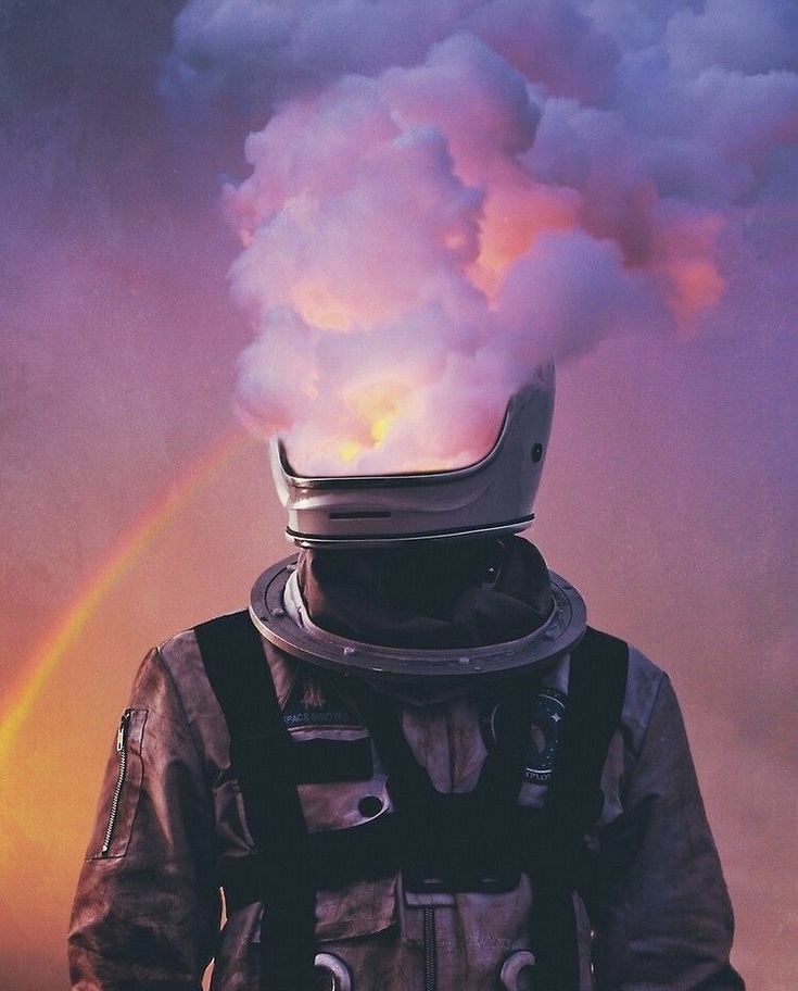 a man wearing a space suit and helmet with a rainbow in the sky behind him