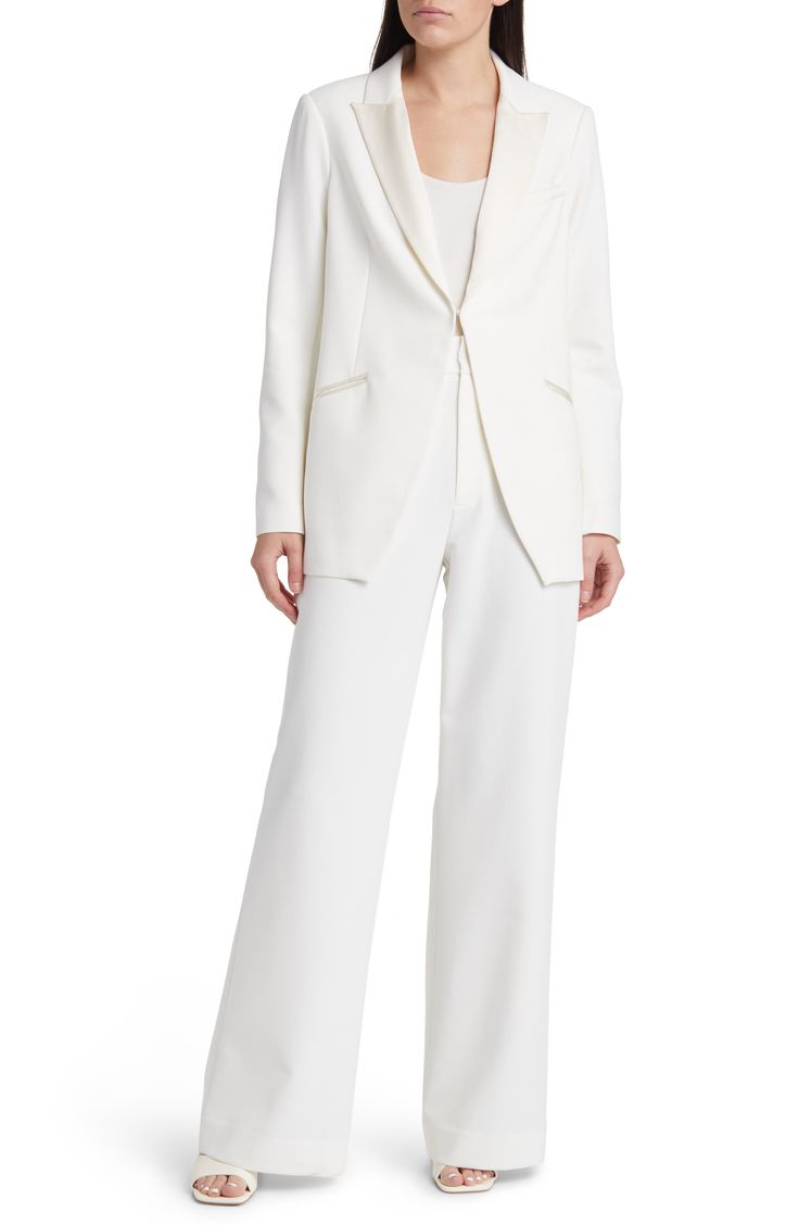 Satin lapels add a formal touch to a snowy blazer fastened with a single hook-and-eye for a clean-lined silhouette. 30" length Front hook-and-eye closure Peaked lapels Three-button cuffs Chest welt pocket; front welt pockets Lined 100% polyester Dry clean Imported Elegant Single Breasted Pantsuit For Formal Occasions, White Tuxedo Style Business Pantsuit, Elegant Single Breasted Formal Pantsuit, Chic Semi-formal Tuxedo With Pressed Crease, Elegant Wedding Blazer With Welt Pockets, Elegant Pantsuit With Notch Lapel And Welt Pockets, Elegant Semi-formal Pantsuit With Welt Pockets, Classic White Evening Suit, Formal Pantsuit With Welt Pockets