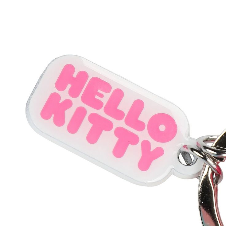 a keychain with the words hello kitty on it