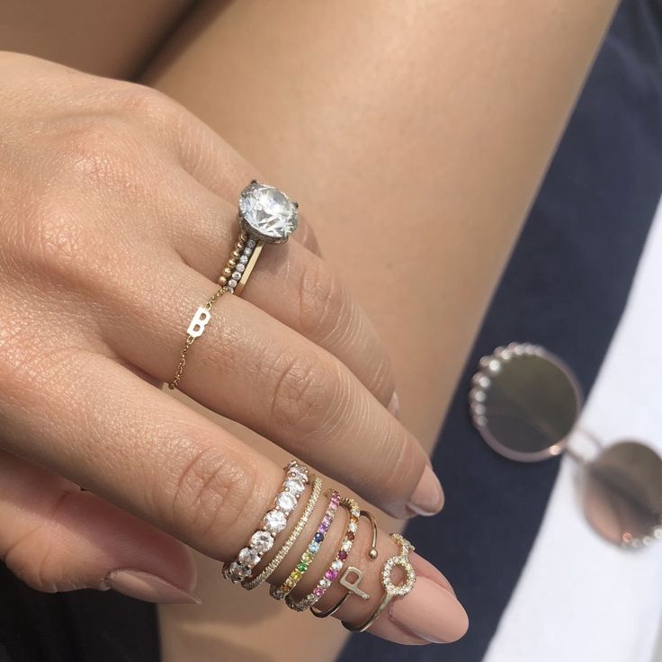 Details: This gorgeous, multicolor Rainbow & Diamond Eternity Band in 14k gold features pavé set color stones alternating with white diamonds all the way around creating an ombré effect. It is delicate and perfect for stacking with your favorite rings or even as an addition to any wedding ring stack. Shop the look: Honeycomb Band, Mini Mini Letter Chain Ring, and Mini Letter Ring Diamonds: 0.25 carats, G color, VS2 clarity Color Stones: Amethysts, Topaz, Ruby, and Sapphires Width: 1.5mm Availabl Everyday Eternity Band With Diamond Accents, Dainty Jewelry With Pave Setting In Cubic Zirconia, Dainty Cubic Zirconia Jewelry With Pave Setting, Dainty Diamond Jewelry With Pave Setting, Luxury Cubic Zirconia Stackable Rings With Pave Setting, Dazzling 14k Gold Stackable Rings, Diamond White 14k Gold Eternity Band, Dazzling Everyday Jewelry With Prong Setting, Dainty Diamond White Diamond Eternity Band