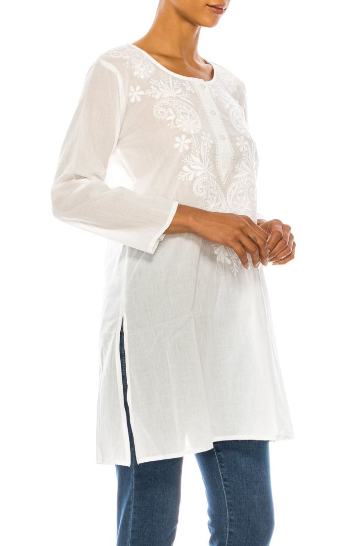 Featured on an elegant white solid background, this tunic is made from 100% natural cotton voile fabric, with floral embroidery by the collar area.Model is 5’8” - wearing size small. Model Bust: 34”Hand-wash cold, lay flat to dry.Made in India. Summer Cotton Kurta With Embroidered Sleeves, Elegant Summer Tunic With Embroidered Neckline, Elegant Embroidered Neckline Tunic For Summer, Spring Kurta With Embroidered Sleeves Tunic, Summer Bohemian Kurta With Embroidered Sleeves, Bohemian Summer Kurta With Embroidered Sleeves, Spring Kurta With Embroidered Sleeves, Tunic Style, Traditional White Kurta With Embroidered Hem, Elegant Spring Tunic With Embroidered Neckline