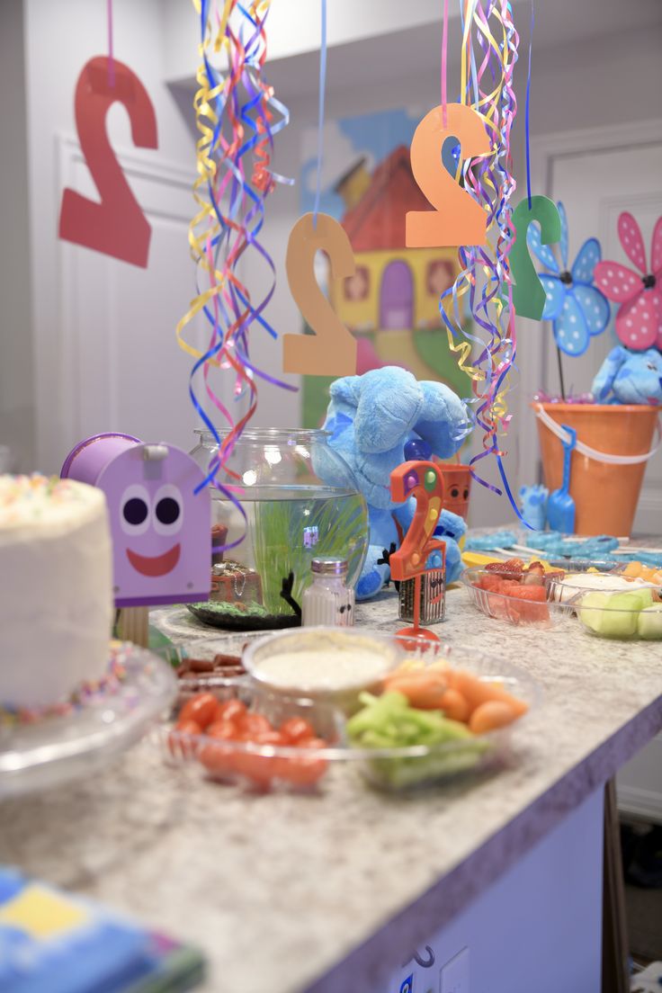 a birthday party with decorations and cake