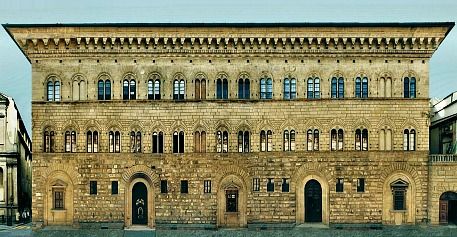 an old building with many windows and balconies