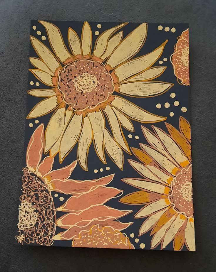 an artistically designed piece of paper with sunflowers on it