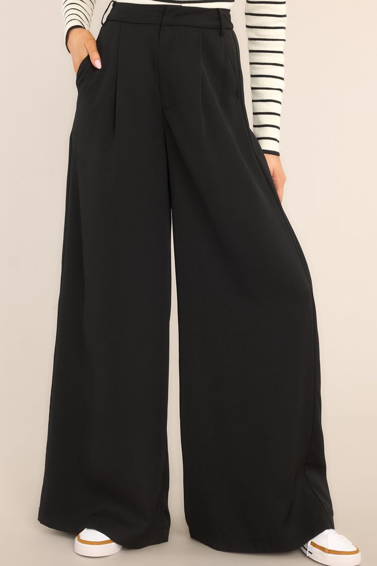 Be the talk of the office in these Office Chic Black Pants! Show 'em who's boss while flaunting your fashion in these timeless versatile black trousers - guaranteed to keep you chic and professional for any occasion. Look effortless when you step into the office. These pants feature a high waist fit, a hook and bar closure, belt loops, pockets, and a wide leg. 100% Polyester Hand Wash Cold Unlined Imported Model is wearing a size small Tailored Office Chic Bottoms For Workwear, High-waisted Dress Pants For Office, Office Lady High-waisted Dress Pants For Workwear, High-waisted Dress Pants For Work, Office Lady Trousers For Workwear, Office Lady High-waisted Pants For Workwear, Office Lady Workwear Trousers, Office Lady Style Trousers For Work, Office Lady Style Trousers For Office