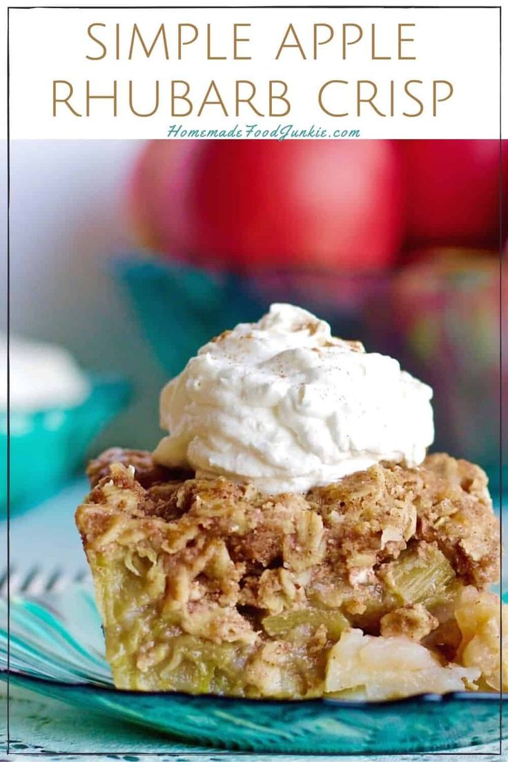 an apple rhubarb crisp on a plate with whipped cream