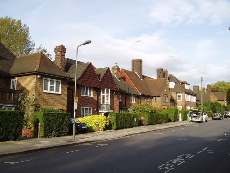 a row of houses on the side of a street