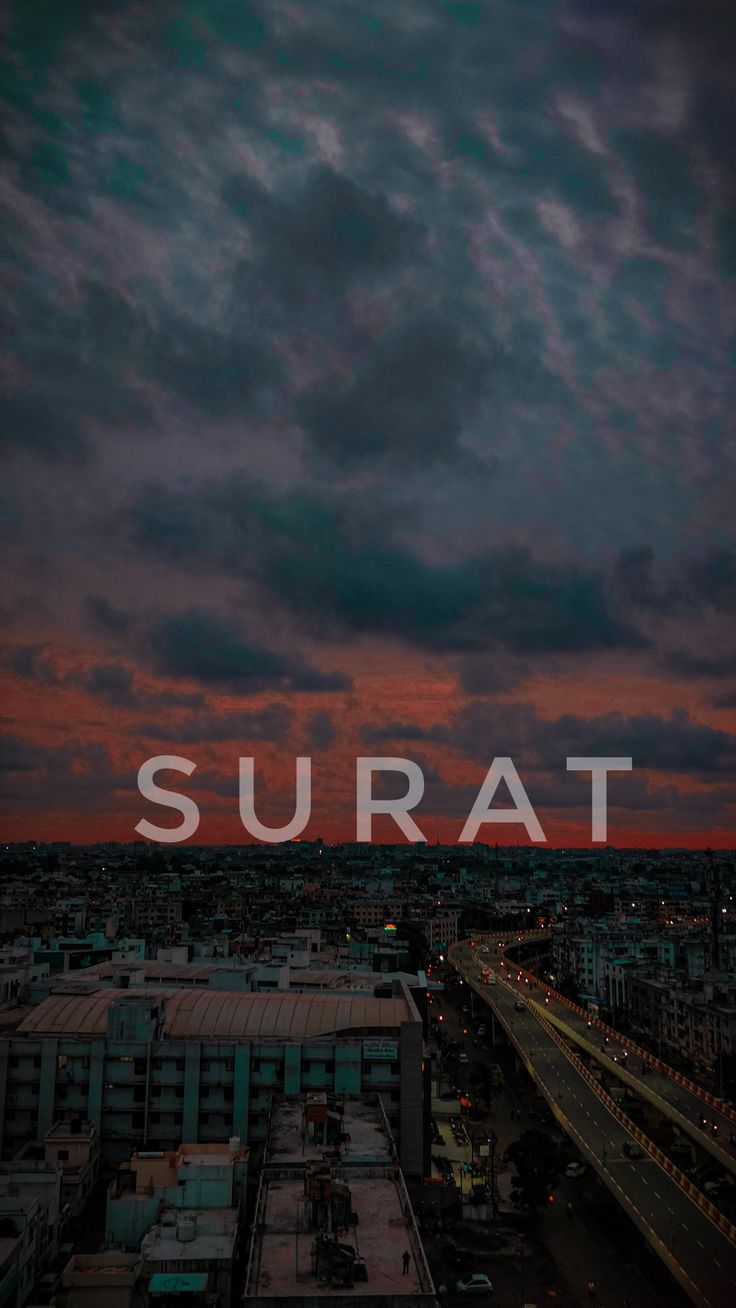 the word surat is displayed in front of a sunset