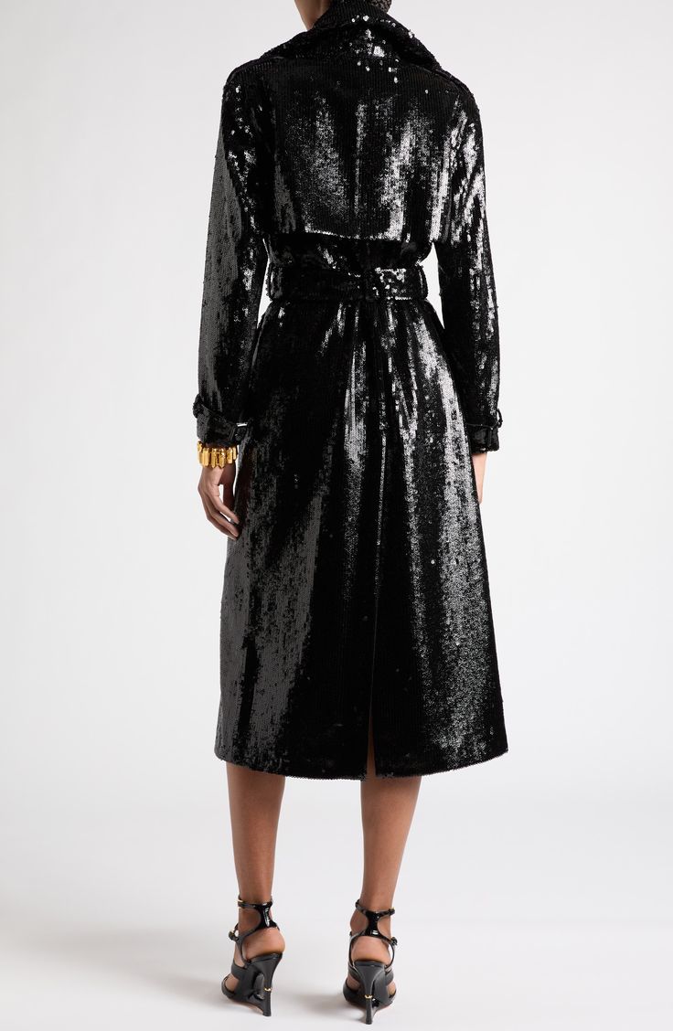 The label's knack for elevating wardrobe essentials into statement pieces is embodied in this trench coat encrusted all over with shimmering sequins. 47" length (size 36IT) Double-breasted button closure Notched collar Adjustable belted cuffs Front welt pockets Epaulets Gun flap Storm flap Removable belt Lined 100% wool Dry clean Made in Italy Designer Clothing Chic Sequined Outerwear For Evening, Chic Sequined Evening Outerwear, Belted Long Coat For Party, Luxury Fall Party Outerwear, Luxury Long Sleeve Sequined Outerwear, Belted Trench Coat, Notched Collar, Welt Pockets, Tom Ford