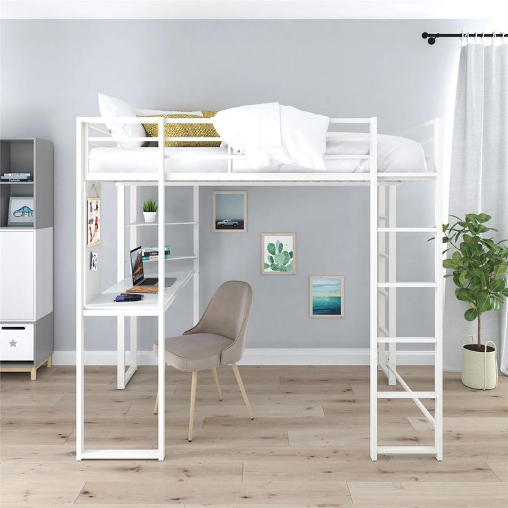 a white loft bed sitting on top of a hard wood floor next to a desk