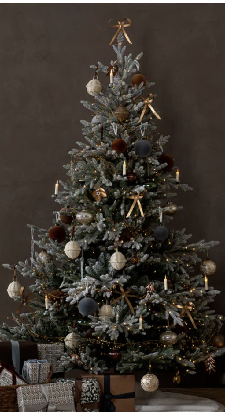 a decorated christmas tree with presents under it