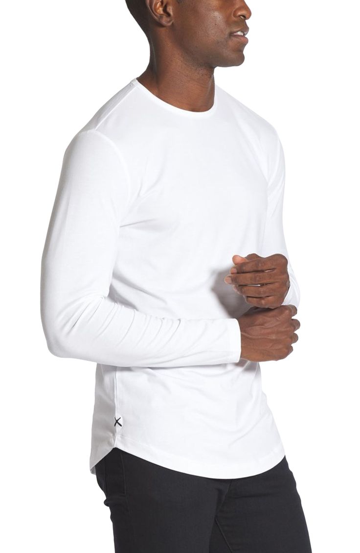 Made from a soft cotton blend, a versatile long-sleeve T-shirt enhanced with a curved hem is an instant closet favorite that looks great alone or layered. Crewneck Long sleeves 62% polyester, 33% cotton, 5% spandex Machine wash, tumble dry Imported Basic Cotton Long Sleeve Top For Loungewear, Basic Cotton Long Sleeve Top For Layering, Everyday Cotton Stretch Long Sleeve Top, Cotton Stretch Long Sleeve Top For Everyday, Cotton Tops With Thumbholes For Loungewear, Everyday Stretch Cotton Long Sleeve Top, Long Sleeve T-shirt For Layering With Relaxed Fit, Everyday Crew Neck Long Sleeve Top With Thumbholes, White Tops With Thumbholes For Loungewear