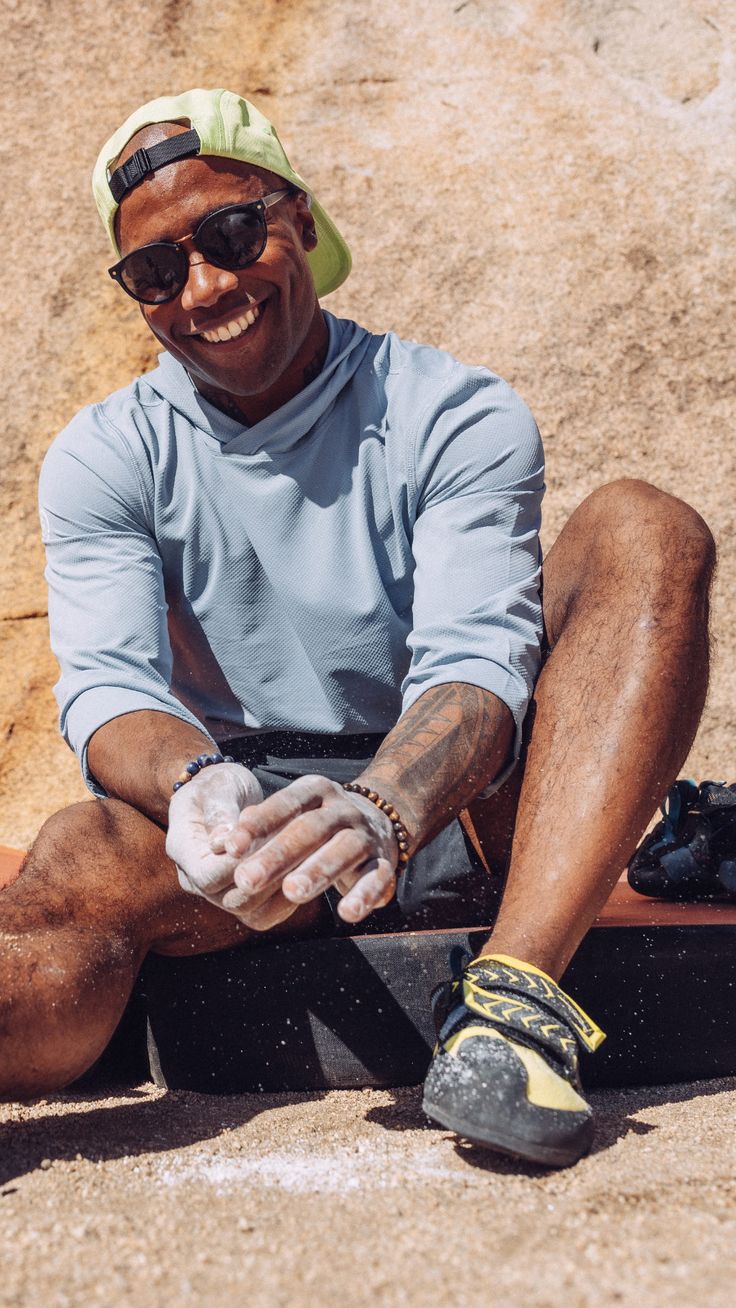 a man sitting on the ground with his feet up