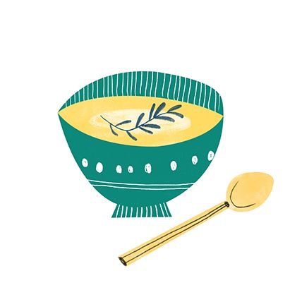 a green and yellow bowl with spoon next to it