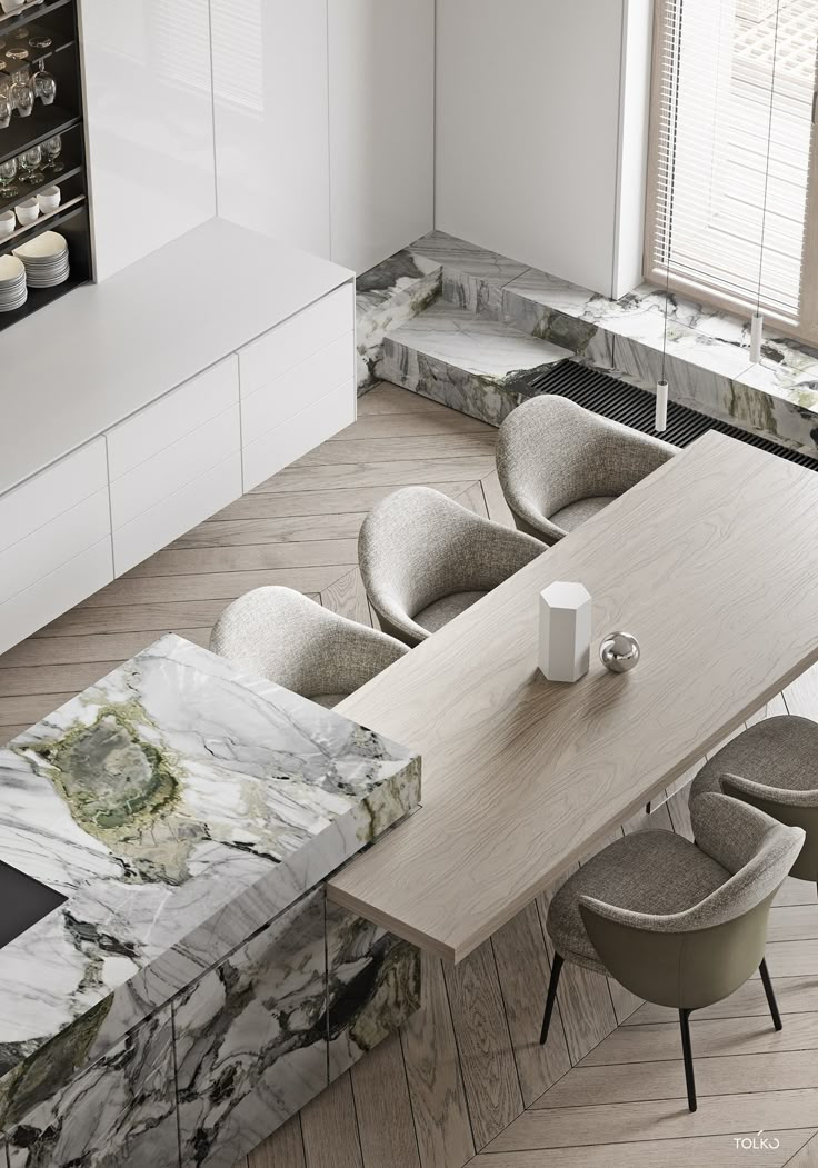 an aerial view of a dining room table with chairs and a marble top, in the middle of a kitchen