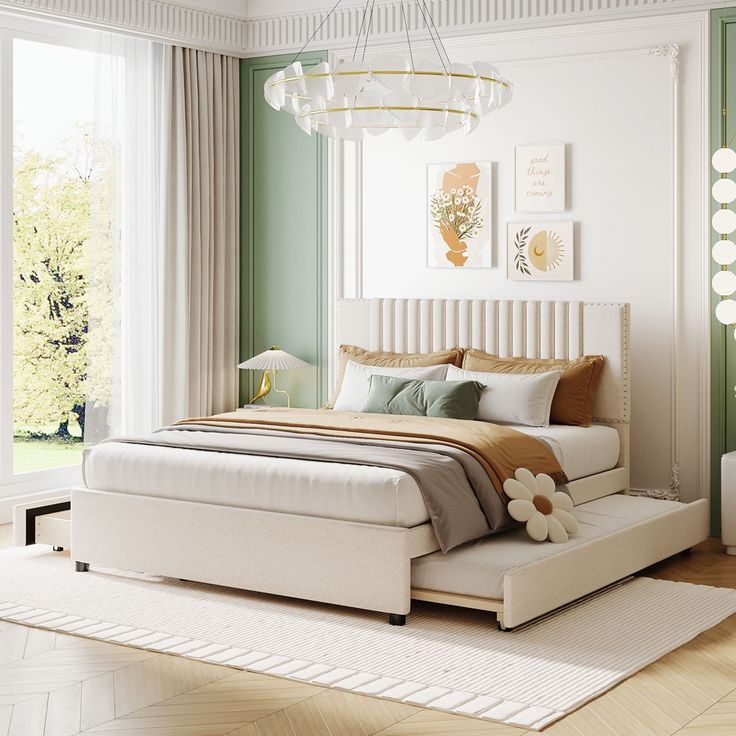 a bedroom with green walls and white furniture