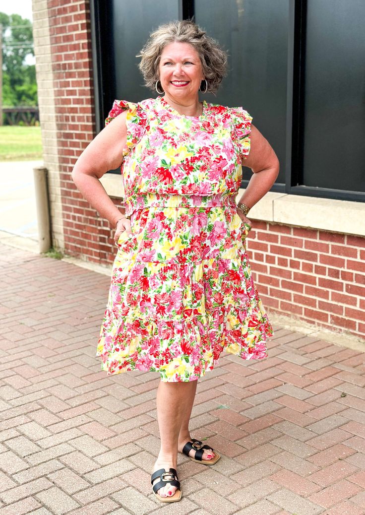 She's a beauty! This bright and fun floral print dress just makes you smile! She's got a ruffle neck, sleeves and one around the bottom. You know we LOVE us some pockets and she's get 'em! Fit: True to size; Mary is 5'5" wearing her TTS medium and Jennifer is 5'6" and wearing her TTS 1X. Material: 100% cotton Color may vary slightly due to monitor/screen settings Multicolor Floral Print Dresses For Daytime, Daytime Multicolor Floral Print Dresses, Fun Floral Print Dress For Garden Party, Fun Floral Print Dresses For Garden Party, Multicolor Floral Print Daytime Dress, Fun Floral Print Vacation Dress, Fun Floral Print Dress For Day Out, Fun Floral Print Dresses For Day Out, Fun Spring Dresses With Ruffles