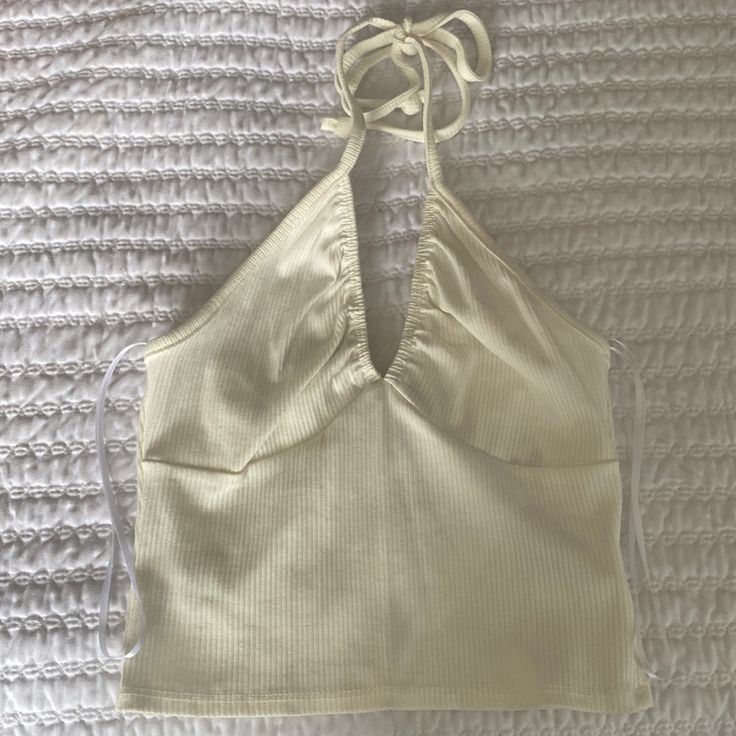 New With Tags. Urban Outfitters Ivory Halter Top. Size Xs Chic White Fitted Halter Top, Chic White V-neck Halter Top, White Cotton Halter Neck Tank Top, White Fitted Halter Neck Top, White V-neck Crop Top For Spring, White Fitted Halter Neck Crop Top, White Casual Halter Neck Tank Top, Casual White Halter Neck Tank Top, Trendy Fitted White Halter Top