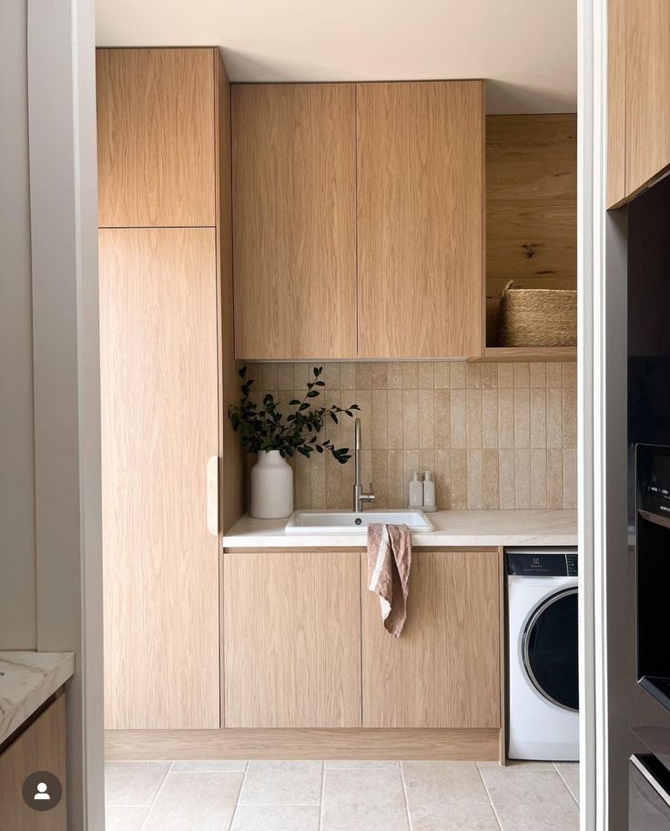 the kitchen is clean and ready to be used as a washer and dryer