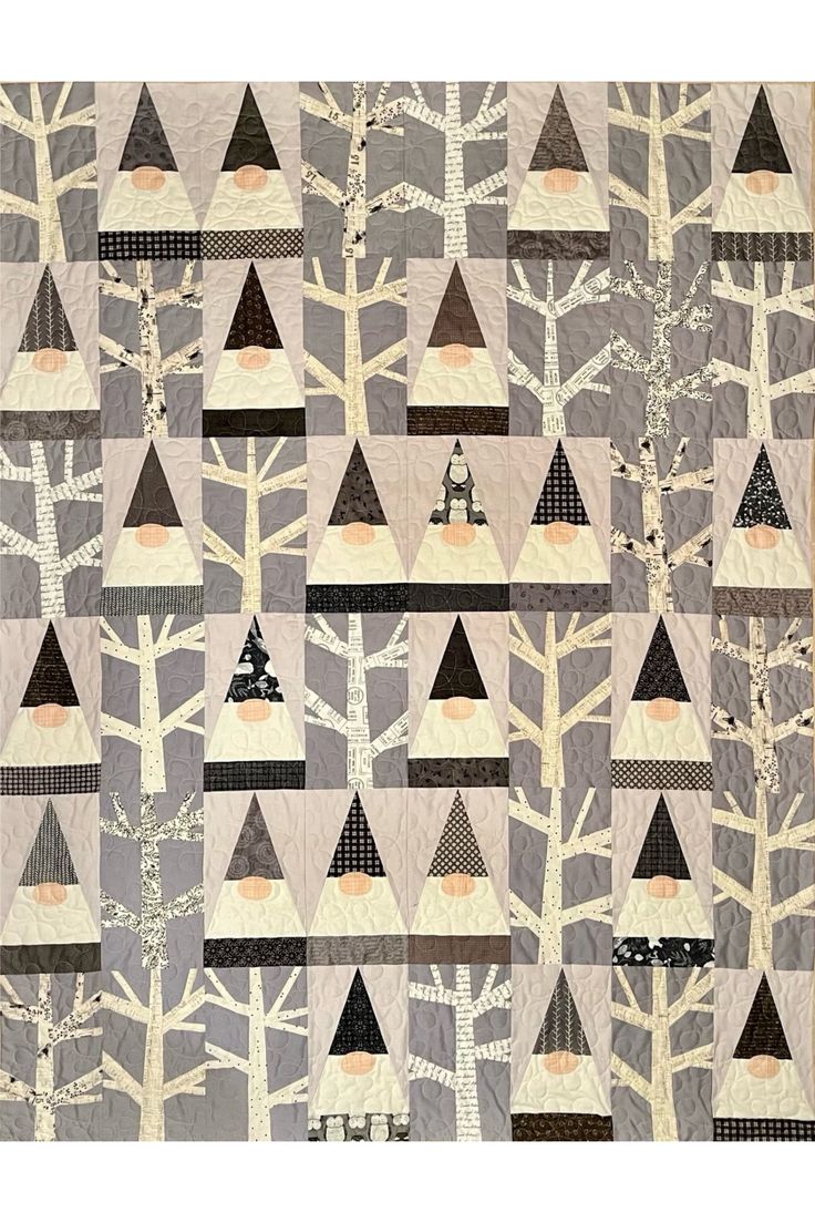 an image of a quilt with trees and houses on it's sides in the woods