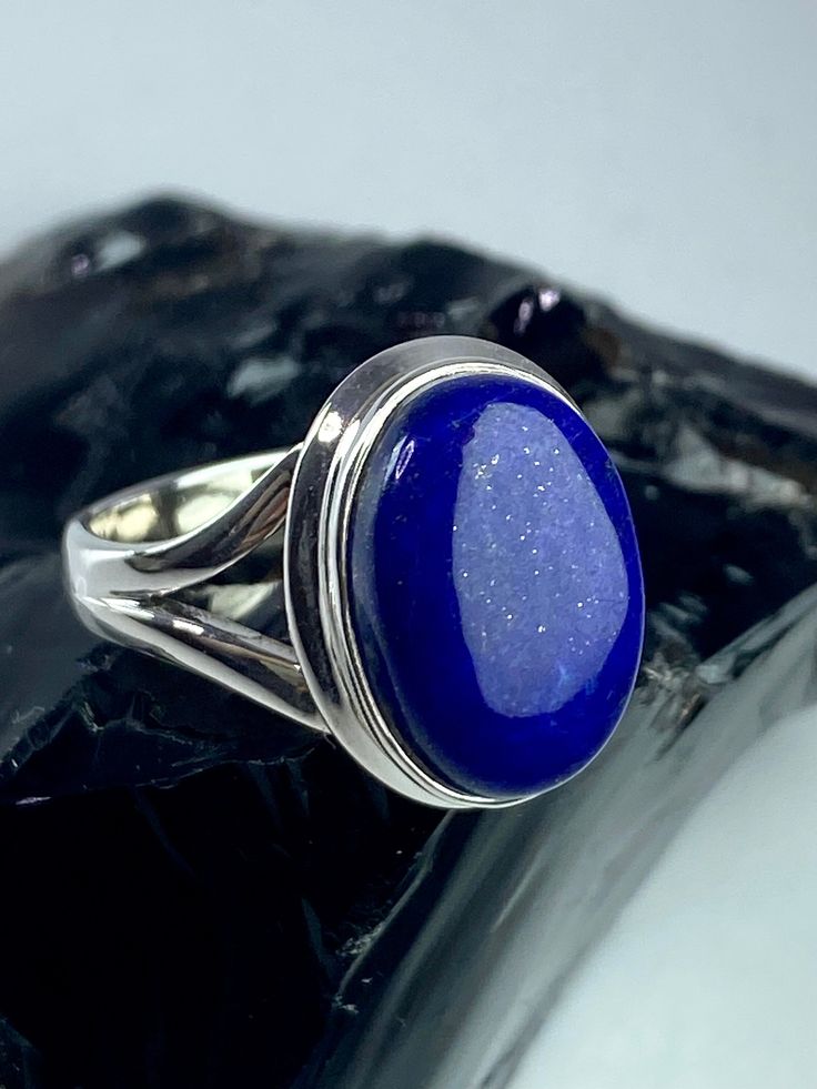 A beautifully sophisticated deep Blue Lapis Lazuli and silver ring. Ring Size - UK P 1/2 or US 8 Ring dimensions - 1.7 cm long x 1.3 cm wide x 0.6 cm deep. Weight - 6 grams. Product made hypoallergenic with pure 925 silver and nickel, lead and cadmium free.  About the stone: Lapis Lazuli is one of the most sought after stones in use since man's history began. Its deep, celestial blue remains the symbol of royalty and honor, gods and power, spirit and vision. It is a universal symbol of wisdom an Classic Blue Lapis Lazuli Rings, Blue Lapis Lazuli Cabochon Rings, Formal Lapis Lazuli Oval Rings, Formal Lapis Lazuli Ring Jewelry, Oval Lapis Lazuli Rings For Formal Occasions, Symbol Of Wisdom, Celestial Blue, Link Ring, Blue Lapis Lazuli