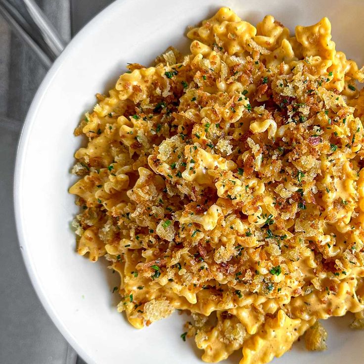 a white plate topped with macaroni and cheese