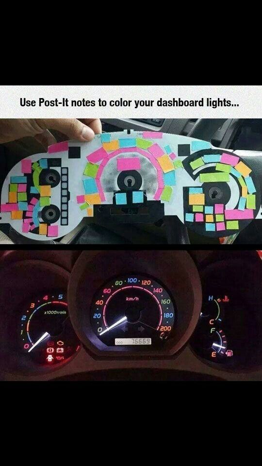 a car dashboard with colorful stickers on it and the gauges in front of it