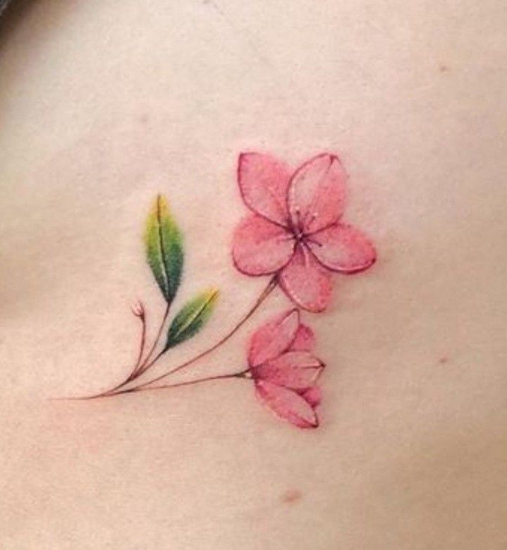 a woman's stomach with pink flowers on it