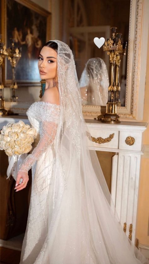 a woman in a wedding dress holding a bouquet