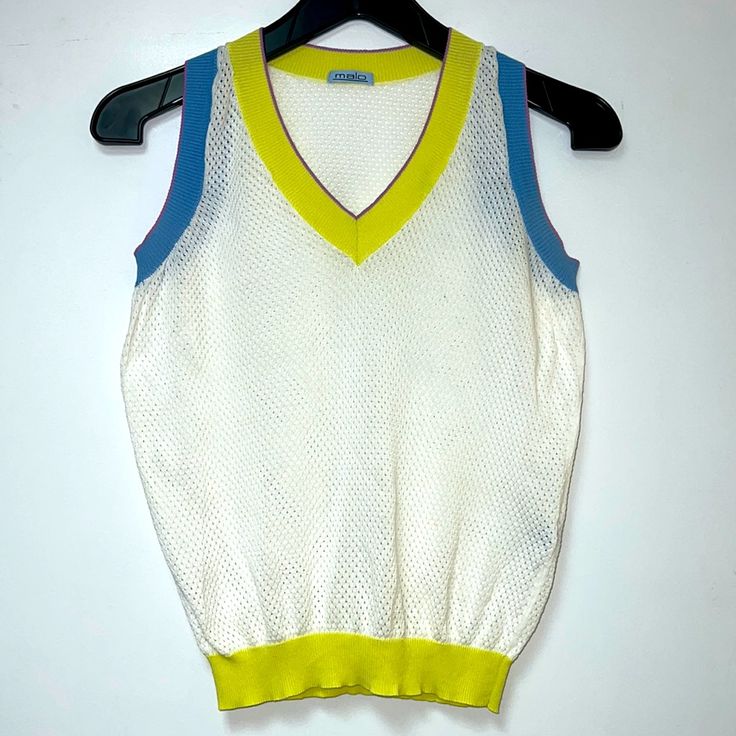 Nwot Malo Italy Sleeveless Summer Crop Top In White With Blue And Yellow Trim. Perforated Super Light 100% Fabric. V-Neck Front Opening. Made In Italy. Size S. New, No Tags Stretch Green Sweater Vest For Summer, Yellow Sleeveless Summer Tops, Yellow Sleeveless Sweater Vest For Spring, White Sleeveless Sweater Vest For Summer, White Stretch Sweater Vest For Summer, Green Tank Sweater Vest For Summer, Stretch White Sweater Vest For Summer, Retro Vest Tank Top For Spring, Casual Yellow Sweater Vest For Summer