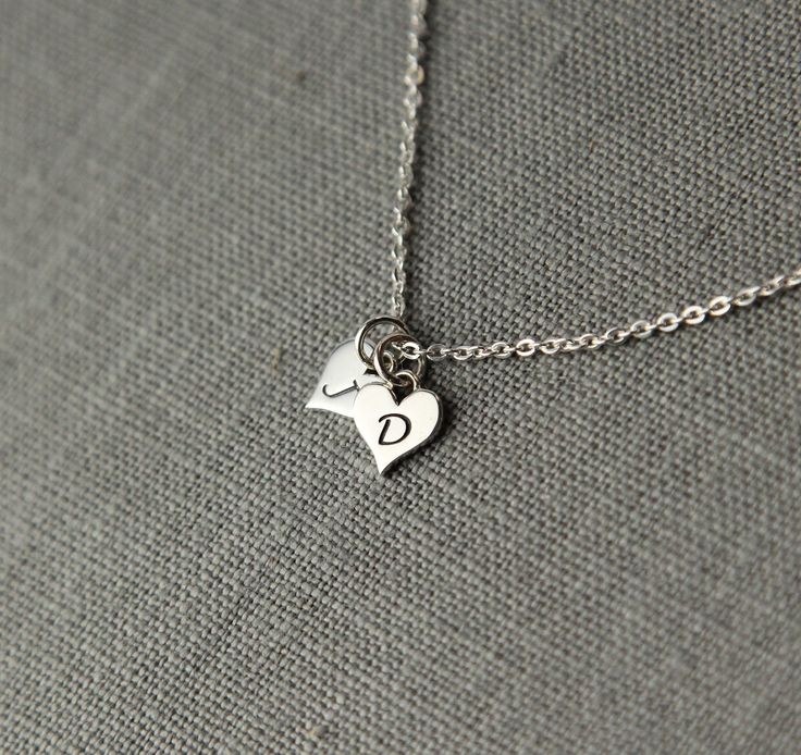 "Two dainty sterling silver hearts with the initials of your choice makes a special keepsake for everyday wear. A thoughtful gift for your sweetheart that she will cherish. TO ORDER -- Please select the initials that you would like from the drop down menus. The Sterling Silver hearts with initials measure 12 x 8mm or approximately just under 1/2\" by just over 1/4\". Please let me know the chain length that you would like in the \"notes to seller\" box at checkout (17\" is the standard length if Boyfriend Girlfriend Necklaces, Couple Initial Necklace, Relationship Jewelry, Engraved Heart Necklace, Couples Necklace, Girlfriend Jewelry, Mothers Bracelet, Valentine Gifts For Girlfriend, Valentine Gifts For Mom