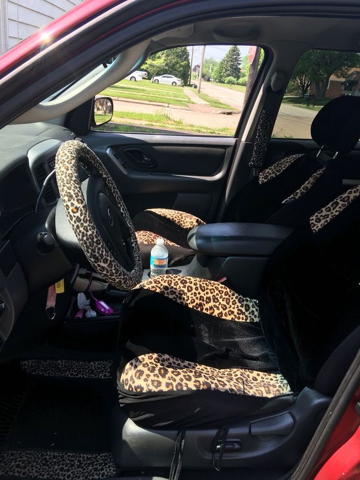 the interior of a car with leopard print seat covers