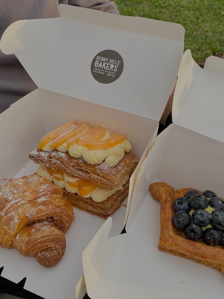 three different types of pastries in boxes