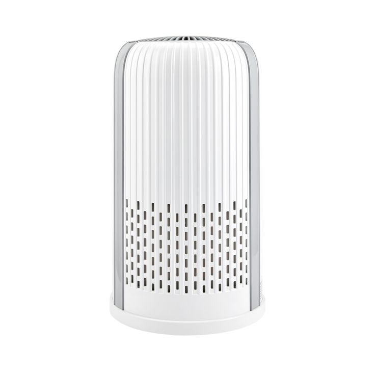 a white air purifier sitting on top of a table