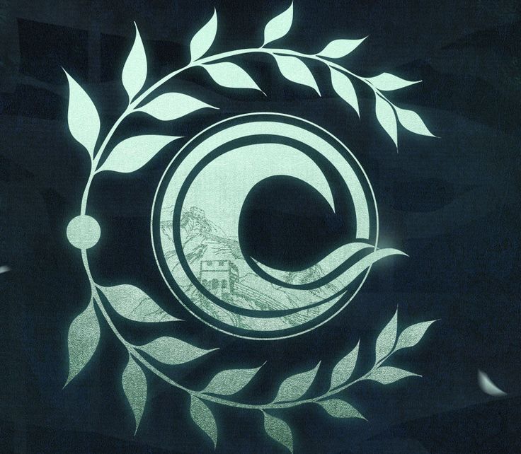 a circular logo with leaves and a house in the background on a black wallpaper