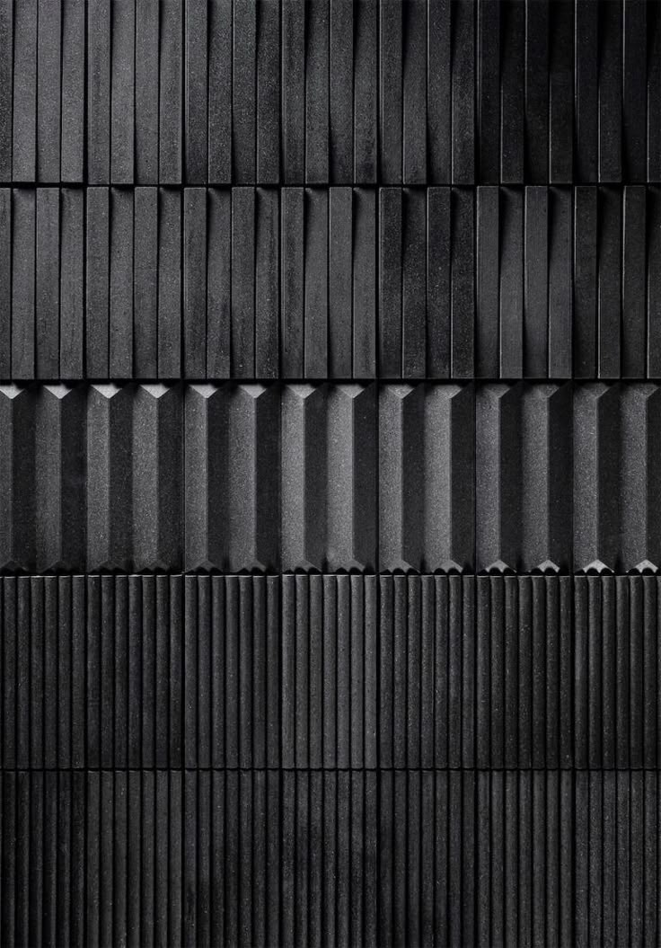 black and white photograph of an abstract wall made from vertical strips of metal sheeting