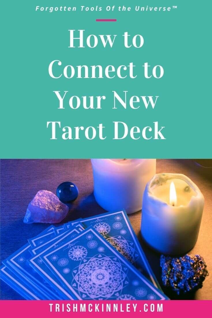 the tarot deck with candles, rocks and stones on it text reads how to connect to your new tarot deck