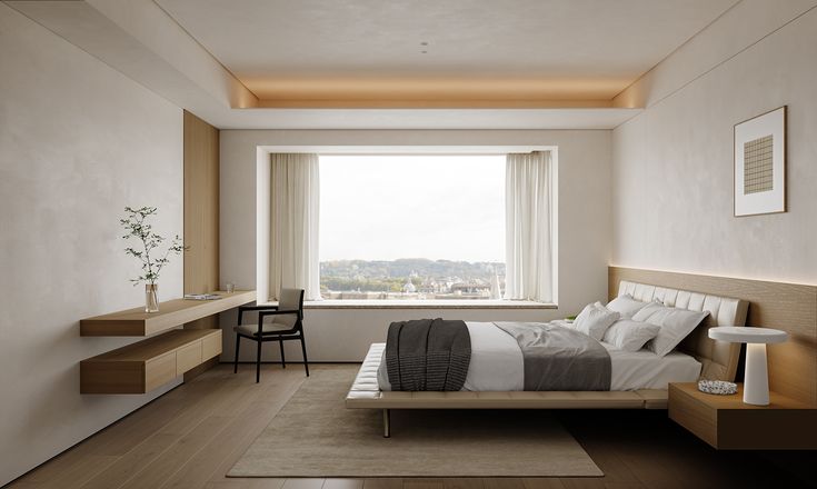 a bedroom with a bed, desk and chair in front of a large window overlooking the city