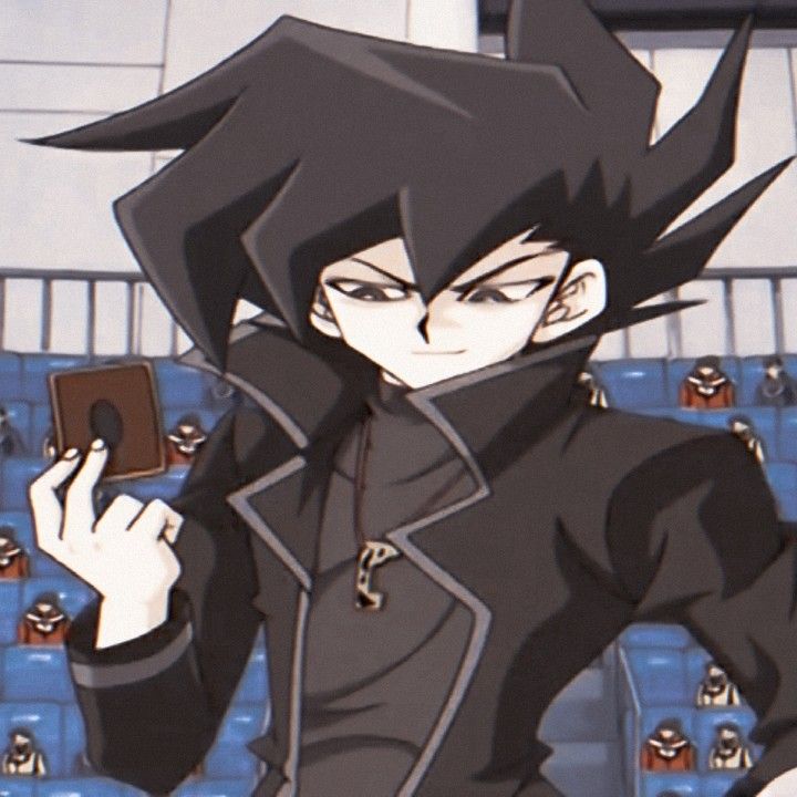 an anime character holding a cell phone in his hand