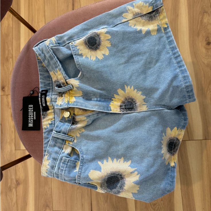 Misguided Sunflower Denim Shorts Yellow Cutoff Bottoms For Summer, Yellow High Rise Jean Shorts For Spring, High Rise Yellow Jean Shorts For Spring, Summer Yellow Cutoff Bottoms, Yellow High Waist Jean Shorts For Summer, Yellow Cutoff Jean Shorts For Spring, High Waist Yellow Jean Shorts For Spring, High Rise Yellow Jeans For Spring, High Rise Jeans With Floral Print For Summer